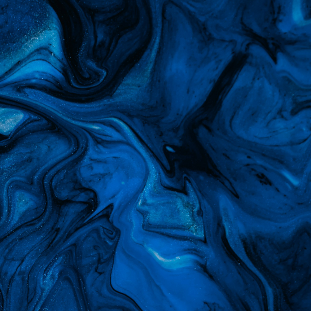 Abstract blue and black swirling marbled pattern with hints of glitter.