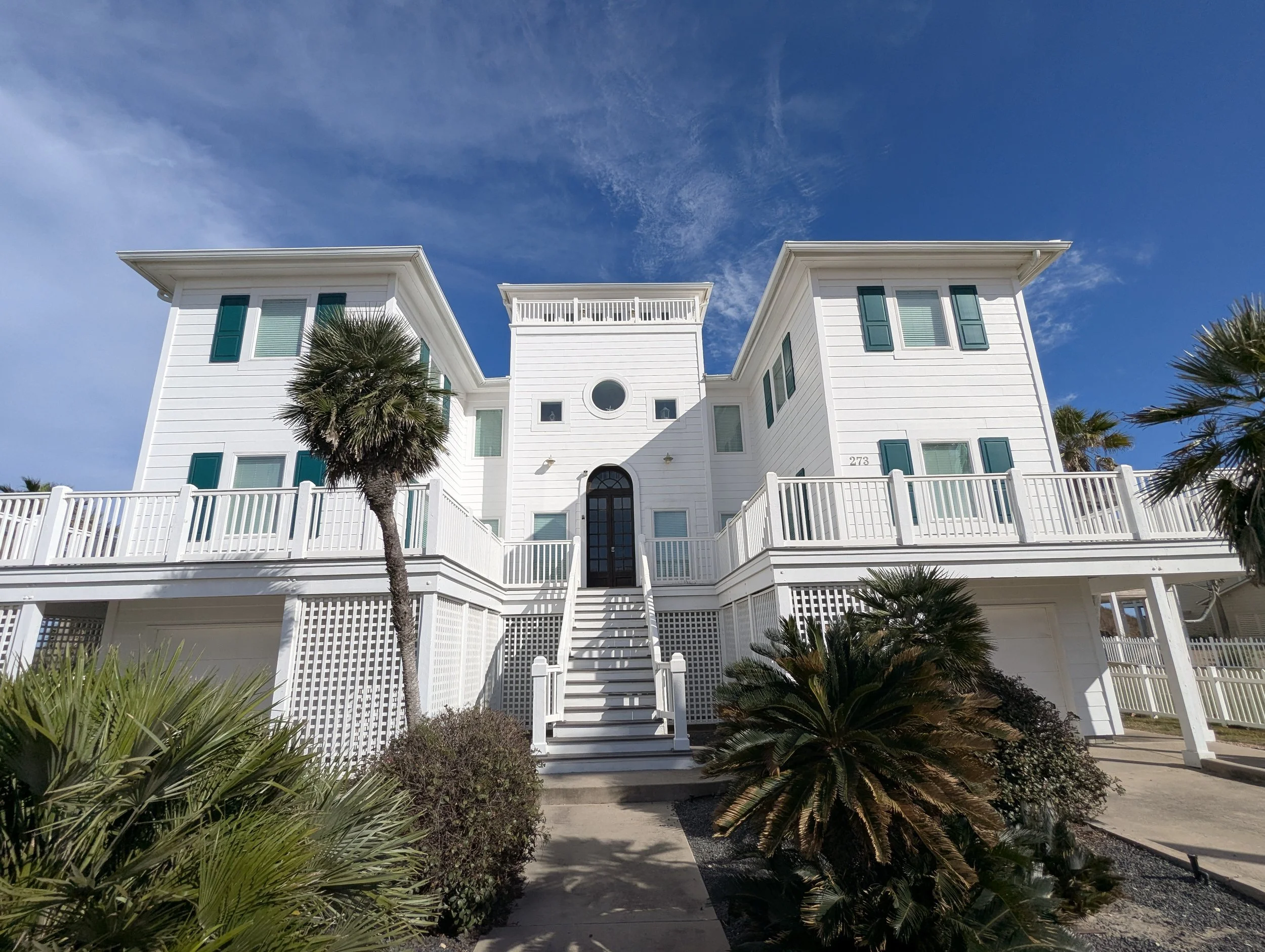 Before: unmade beds and dishes awaiting turnaround — North Padre condo