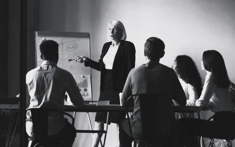 Corporate meeting discussing business tax relief and financial planning