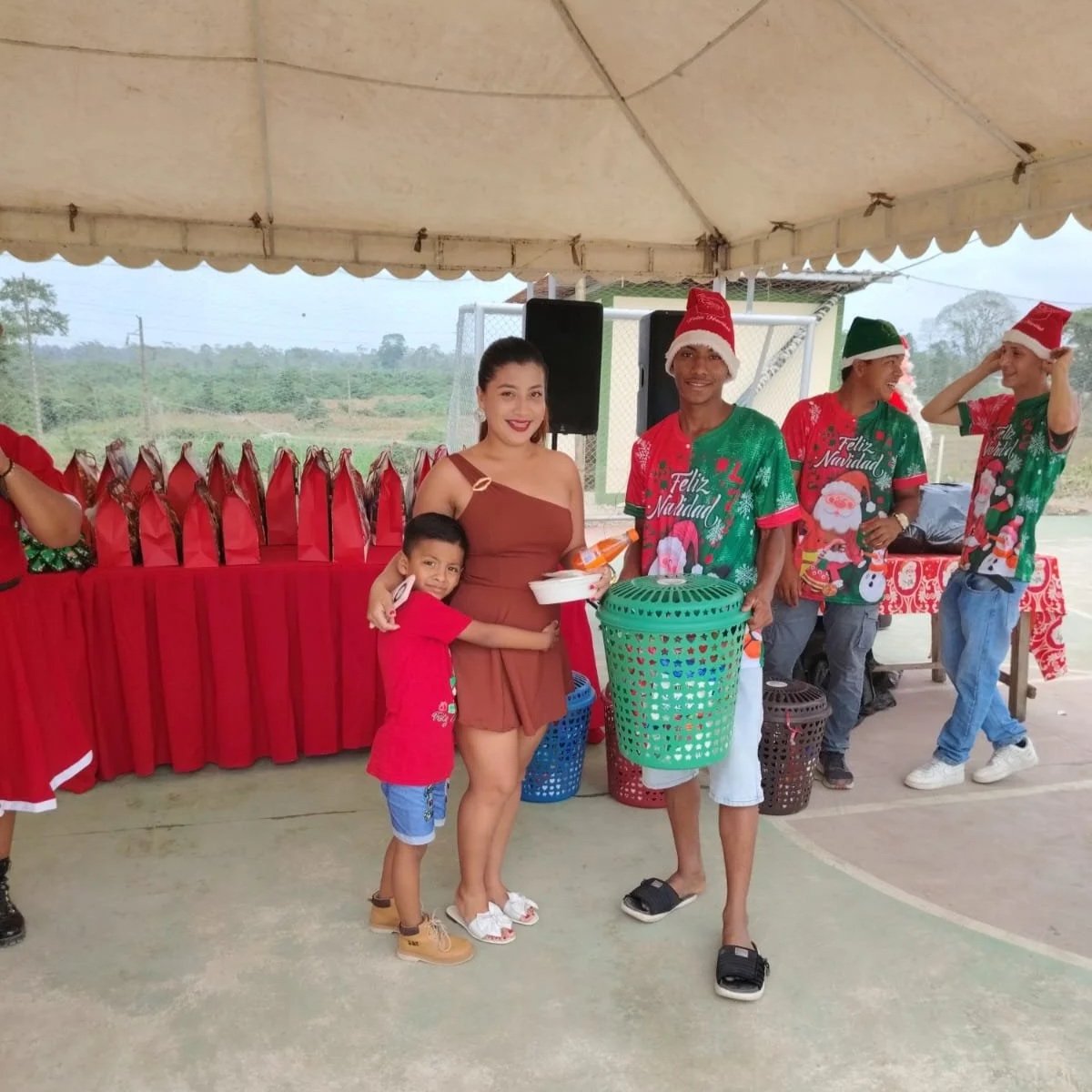 Community members receiving Christmas food baskets, Tenguel 2025.