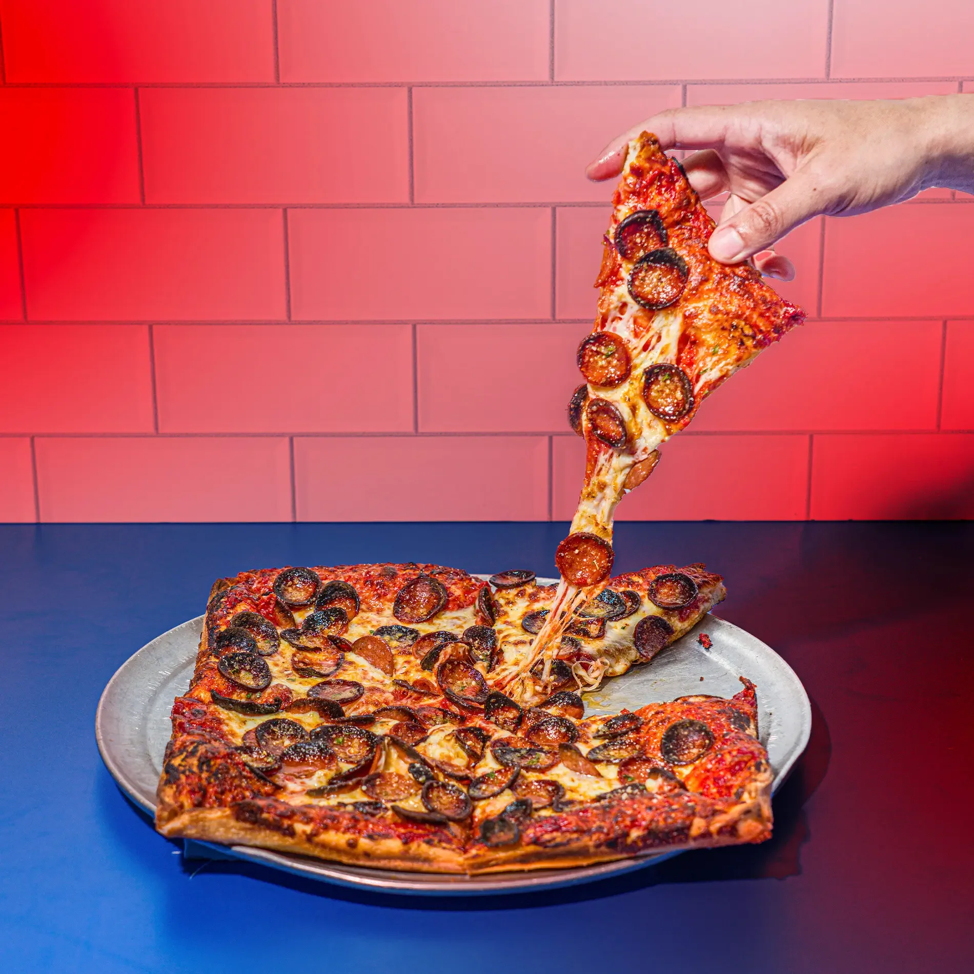 A delicious slice of Buffalo style pizza from Picasso's Pizza.