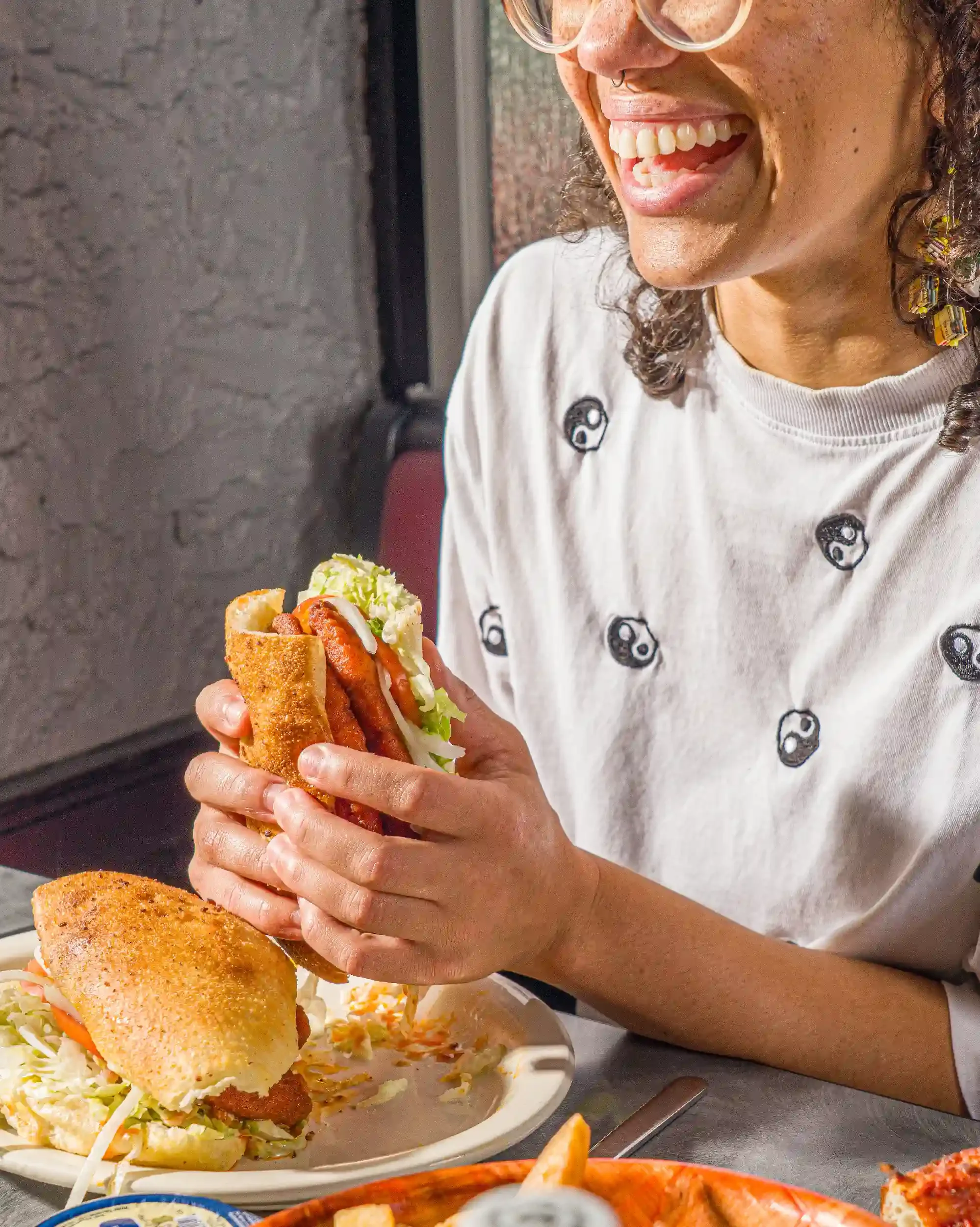 woman-eating-sub.webp