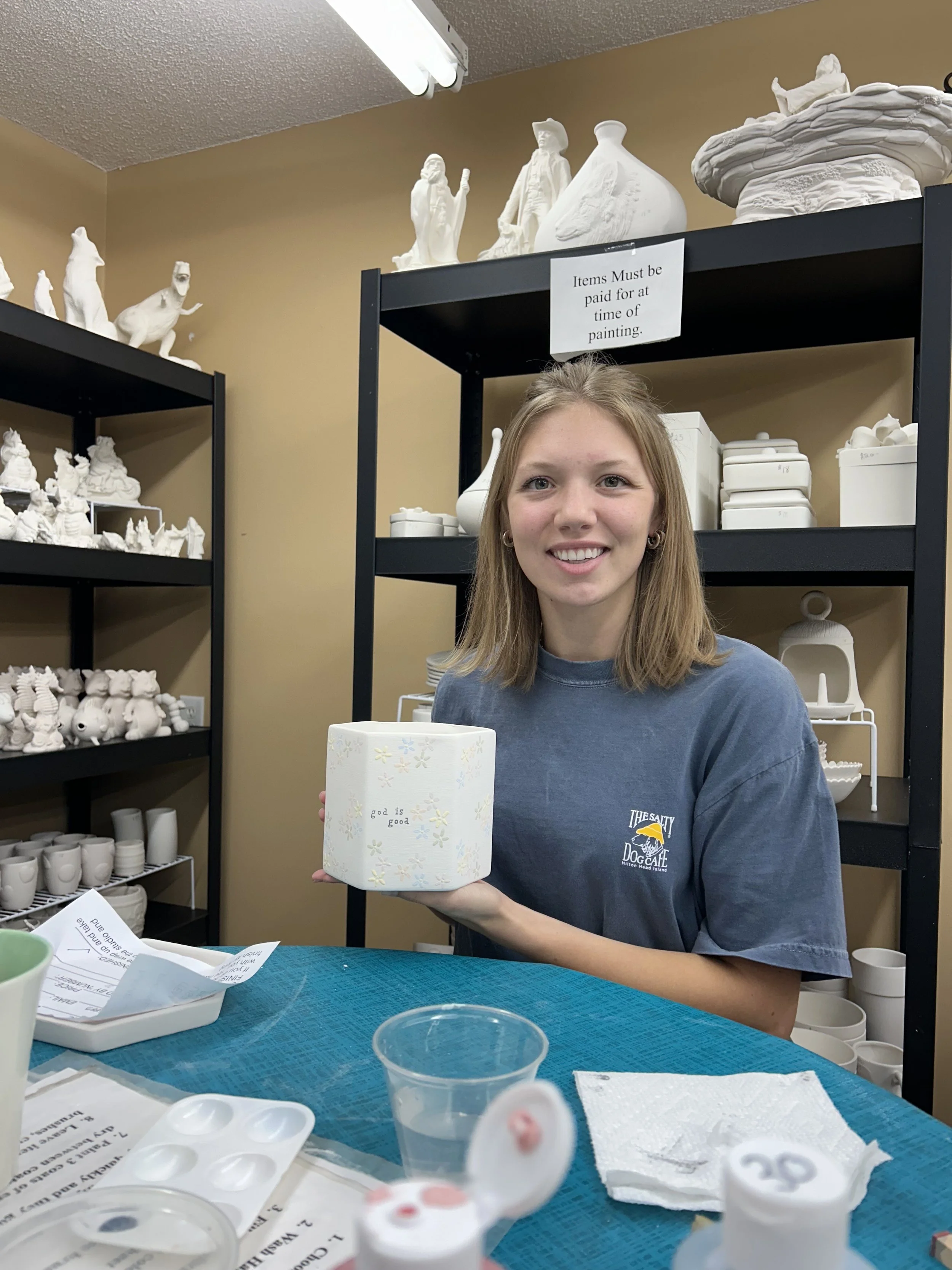 Tatum with a ceramic piece