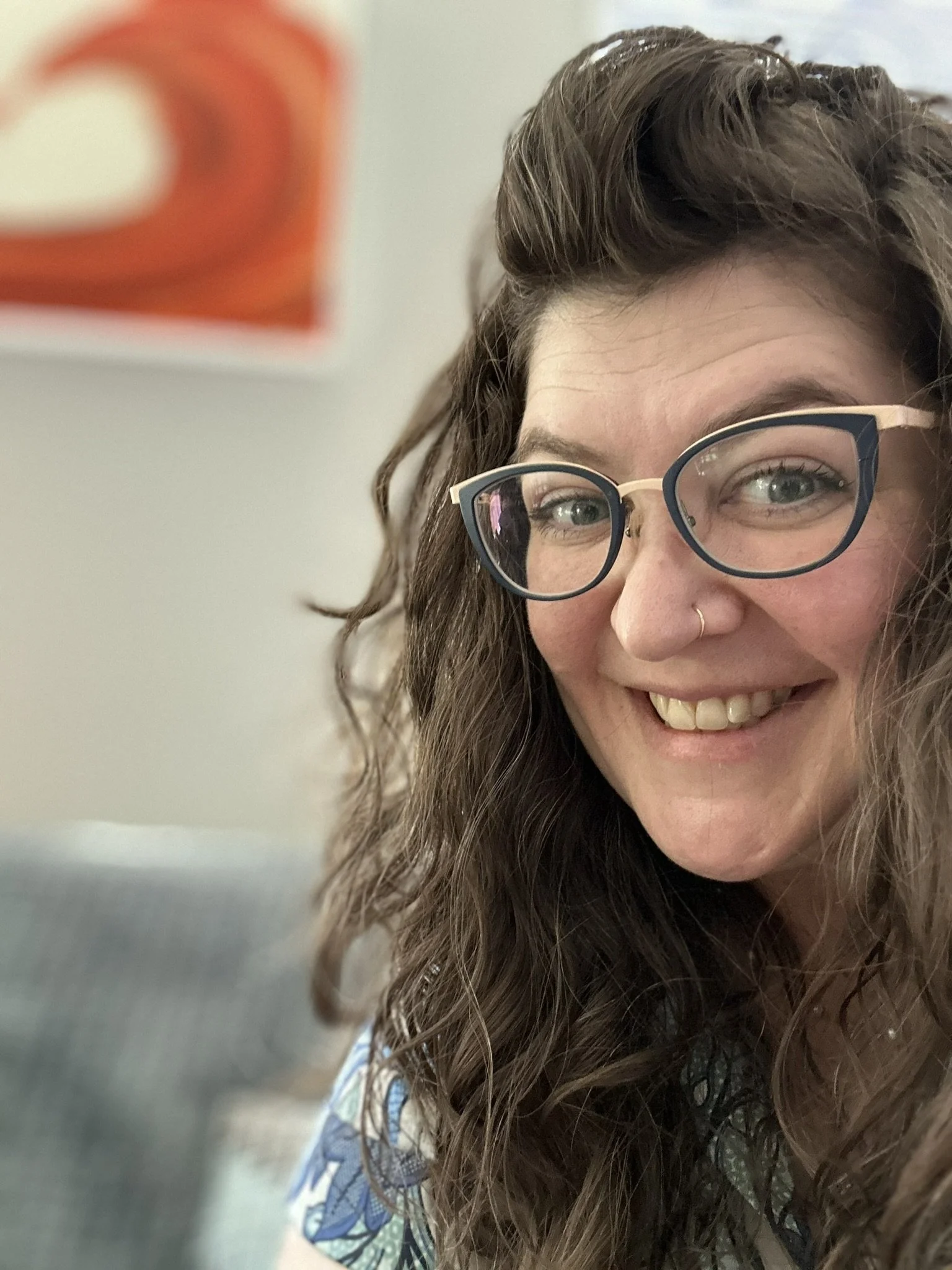 Jackie peeking into the picture with a grin, long hair, glasses, and sense of freedom the other two images do not portray.  Happiness is real in this picture, not staged.