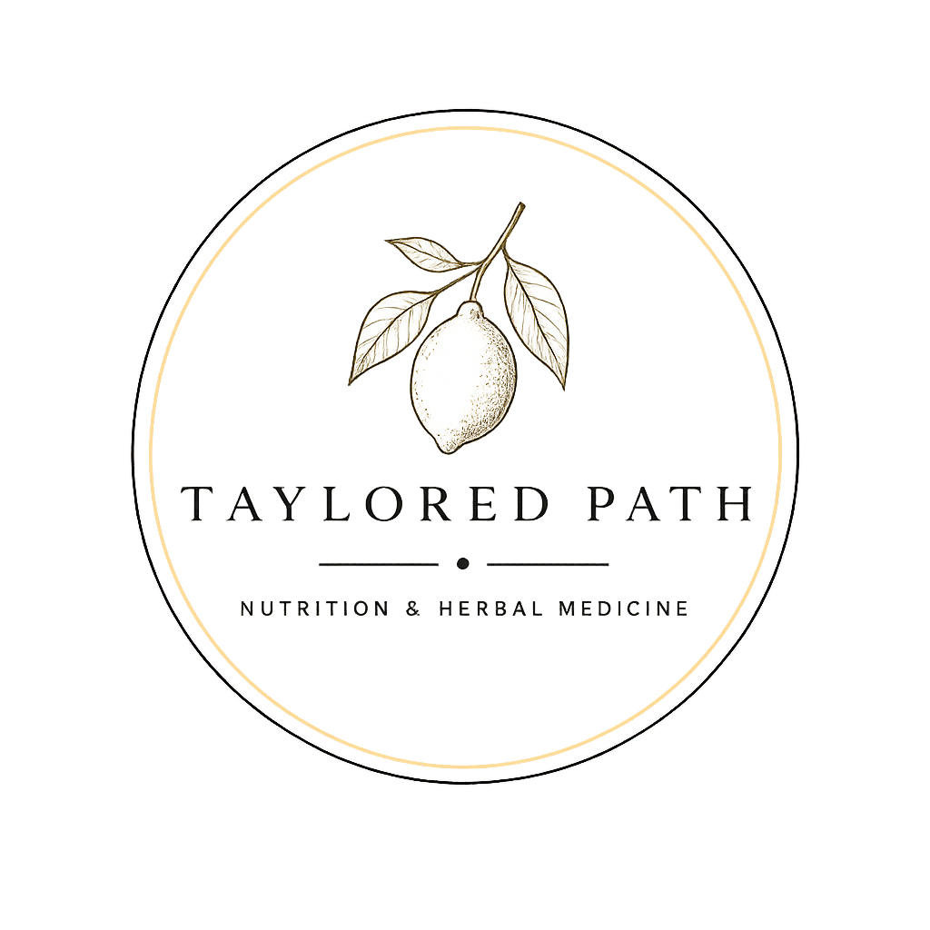 Logo for Taylored Path Nutrition & Herbal Medicine featuring a lemon illustration and elegant text on a black background.