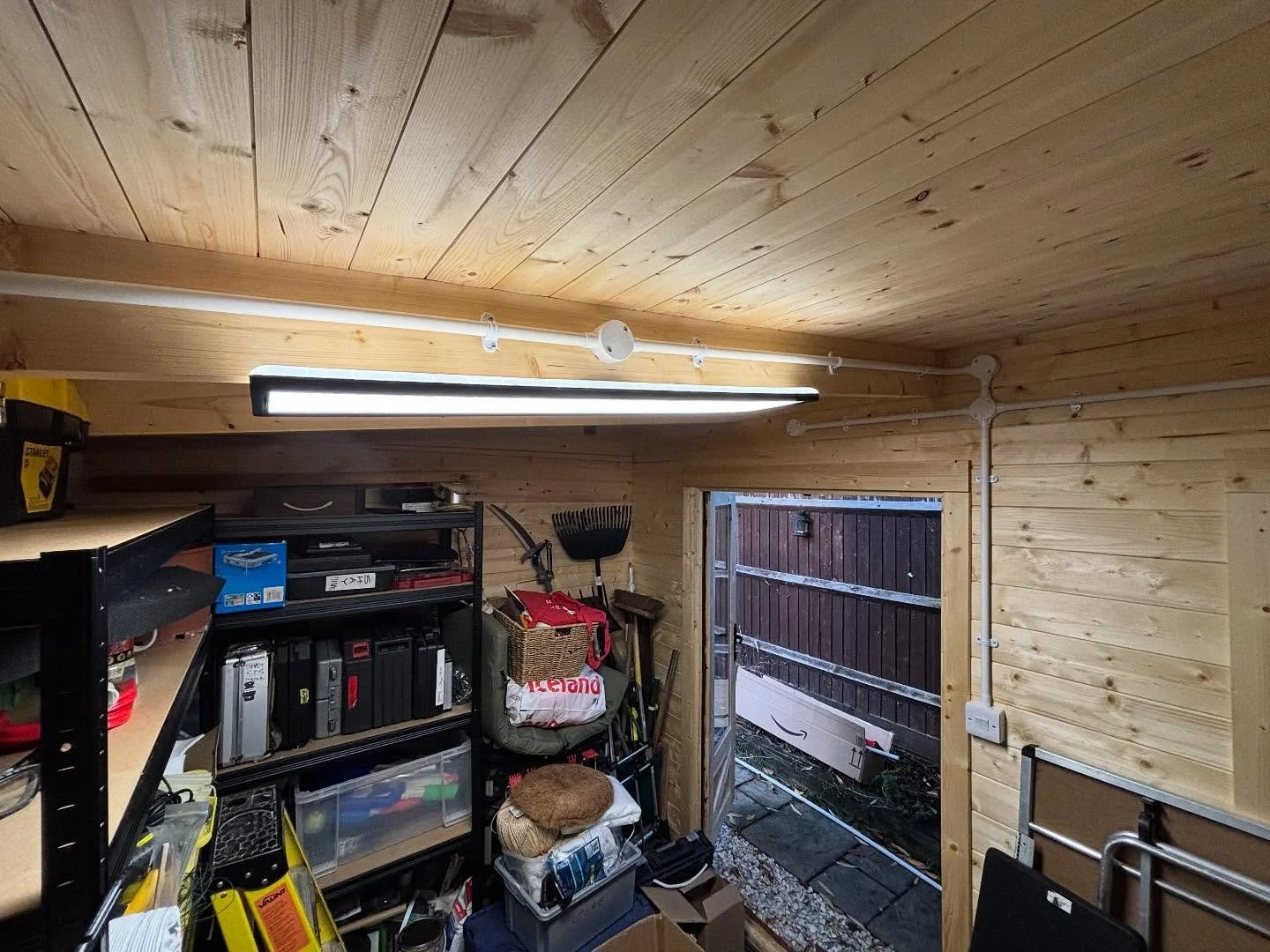 Installed new submain and consumer unit to feed lighting and power within the garden room / office, complete with white surface conduit and a local IP-rated socket for outdoor use ⚡️