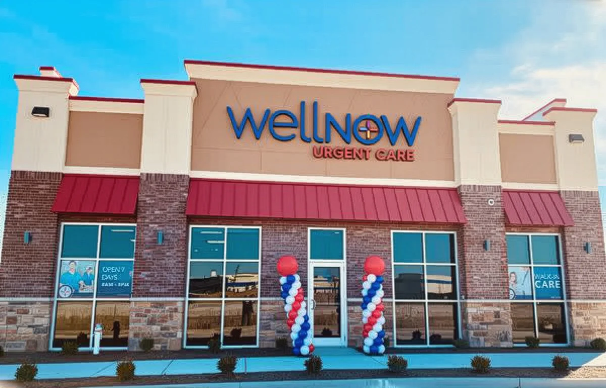 Exterior of WellNow Urgent Care building decorated with red, white, and blue balloons at the entrance.