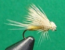 Close-up of a white fishing fly tied to a fishing hook