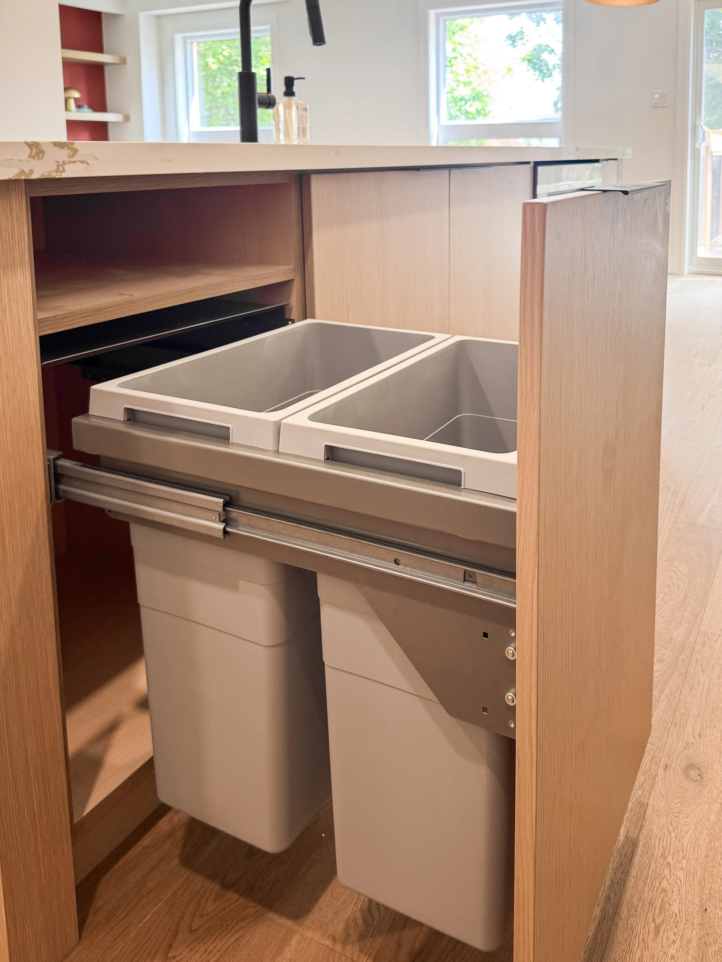 Custom Interior Organizers Including Double Waste Bin Pull Out.
