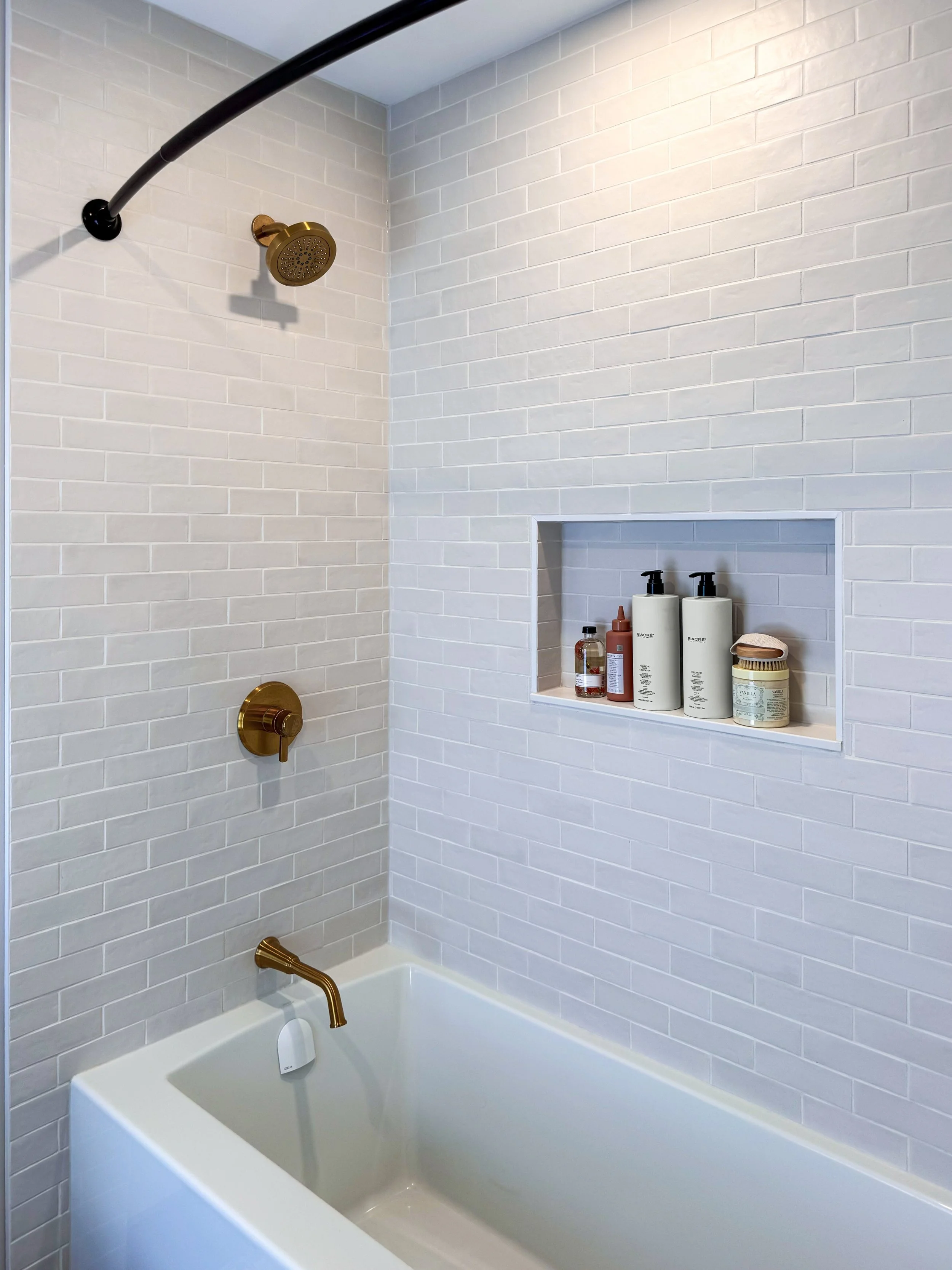 Custom Tub and Shower Combination with Tiled Surround and Niche.