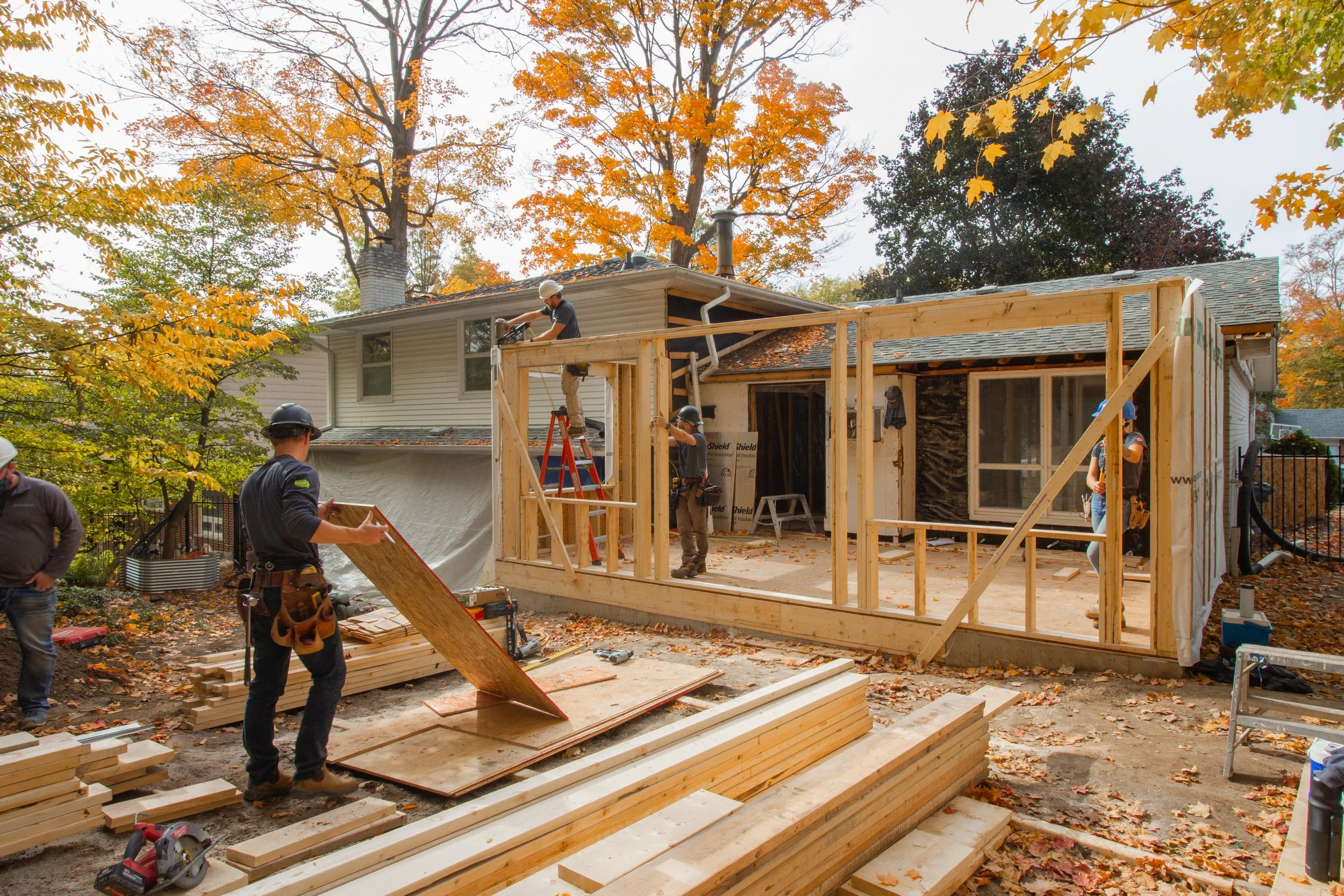 A Catalyst General Contracting crew framing a new home addition during the fall in Kitchener-Waterloo to prepare for winter interior work.