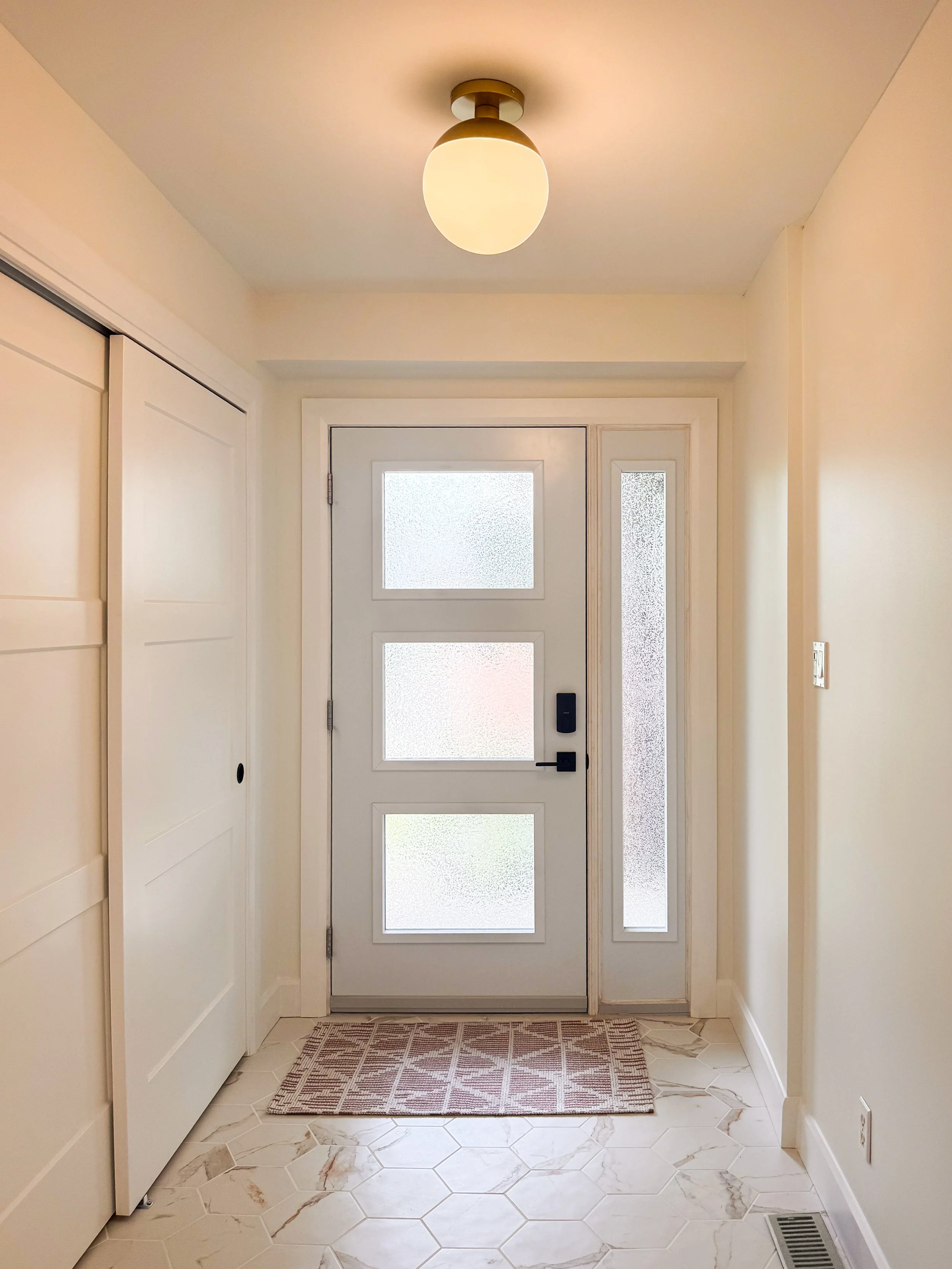 Updated Hexagon Tile and New Closet Doors in Foyer.