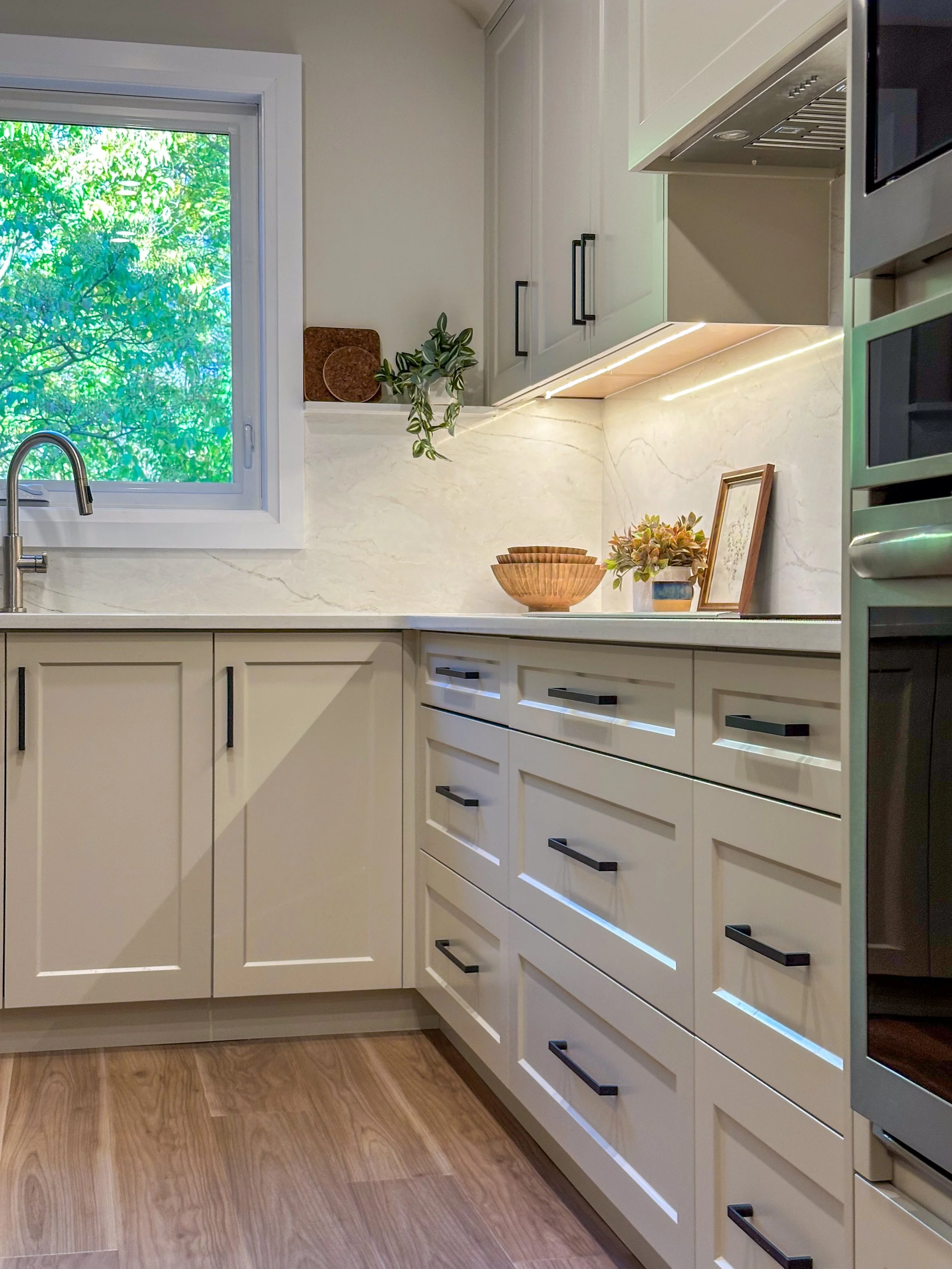 Custom Cabinetry Detail With Matte Black Hardware and Soft Taupe Finish