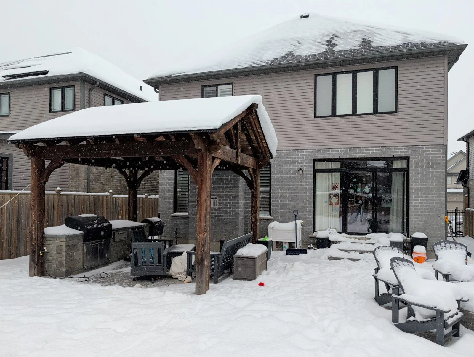 A look at the original backyard footprint prior to the build. The homeowners already had a beautiful stone outdoor kitchen and patio setup that we wanted to carefully preserve and build around.   