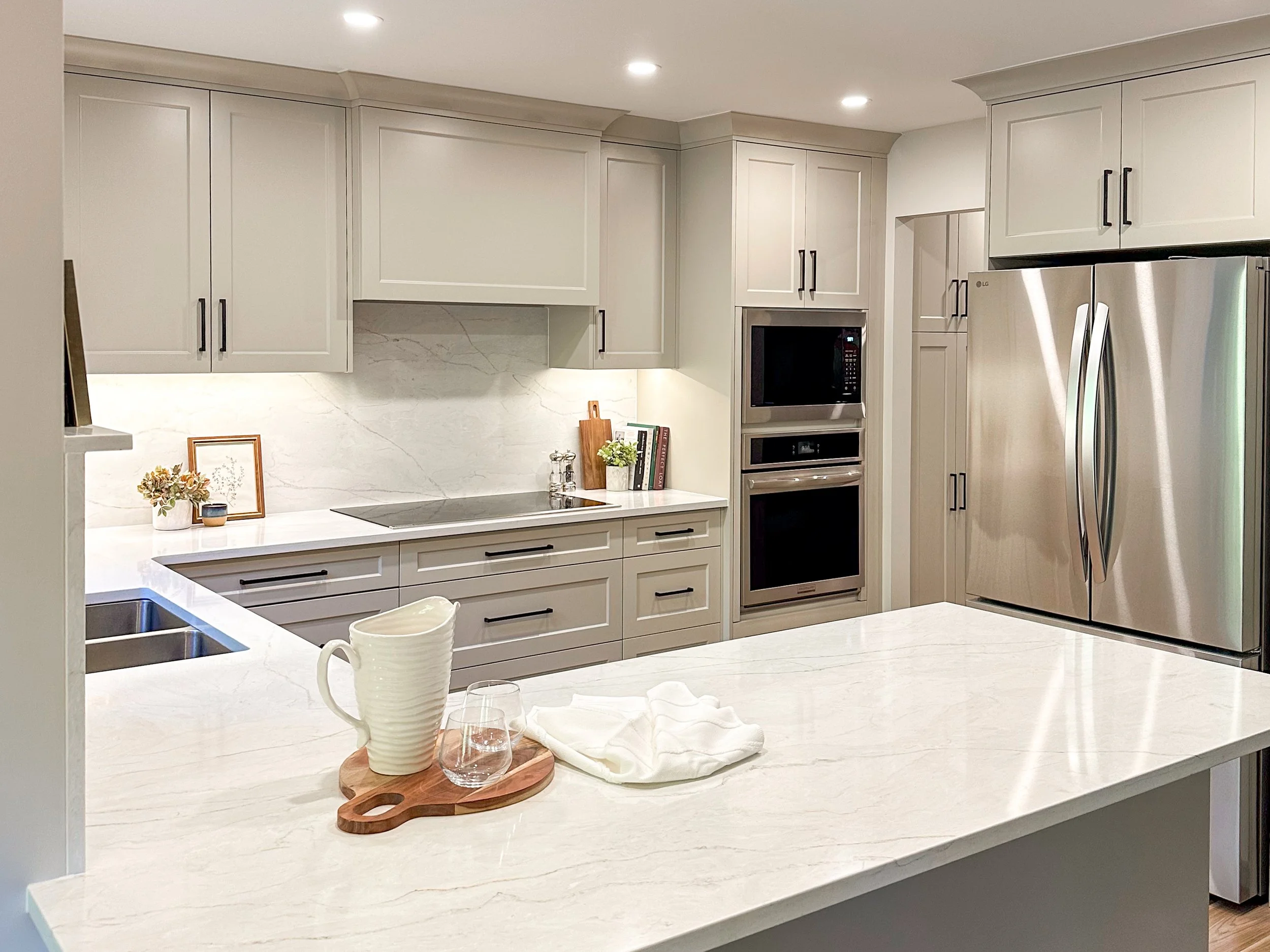 Bright and Airy Kitchen Renovation With Soft-Toned Cabinetry and Full Height Quartz Backsplash