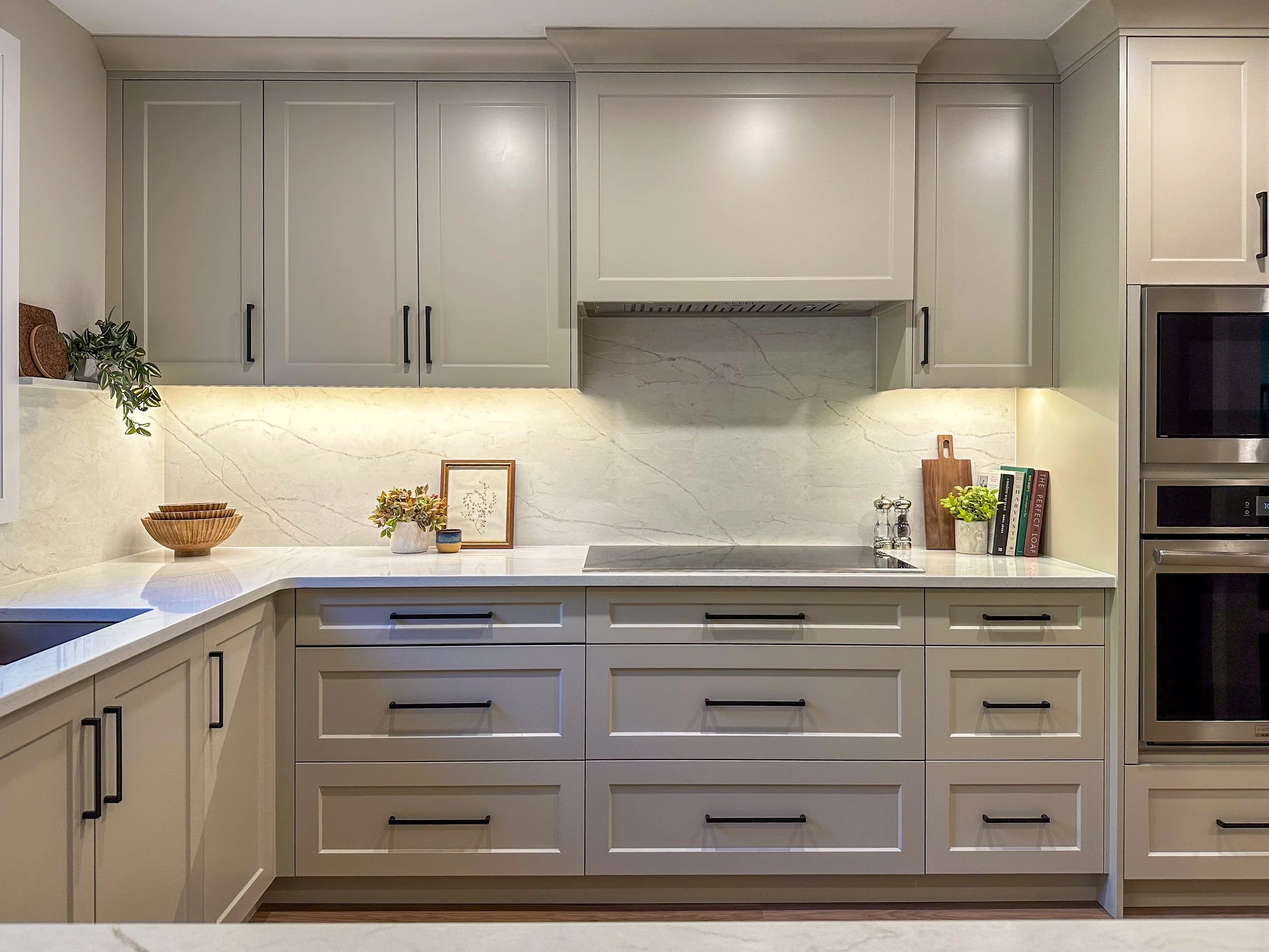 Symmetrical Cooktop Station With Custom Box Hood and Wide Pot Drawers