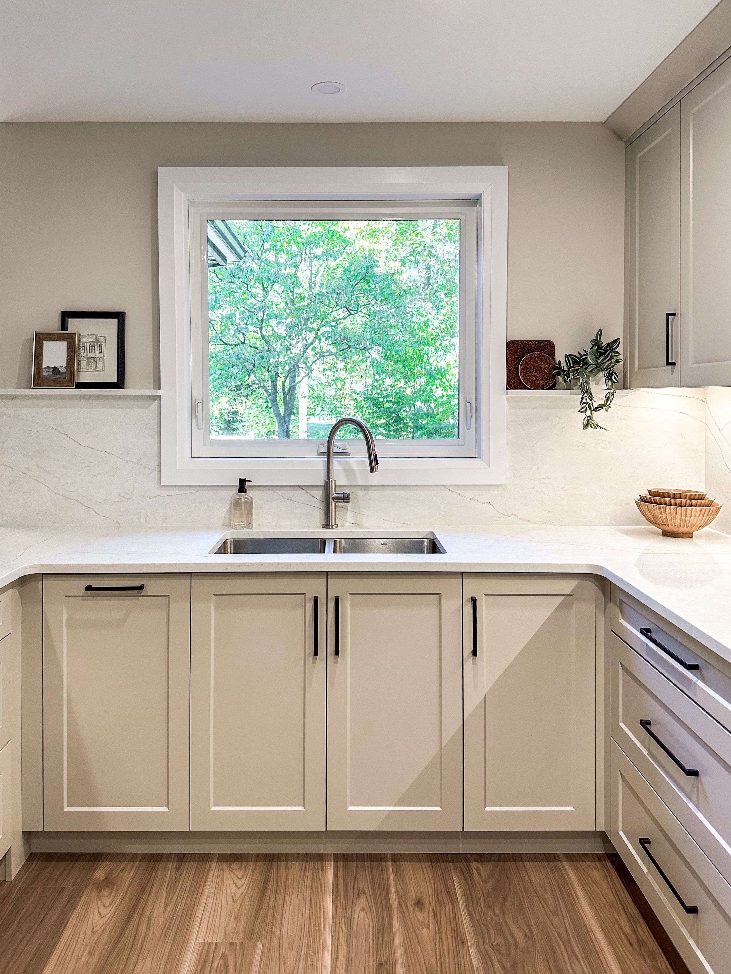 Bright Kitchen Sink Station With Undermount Sink and Quartz Window Sill Ledge