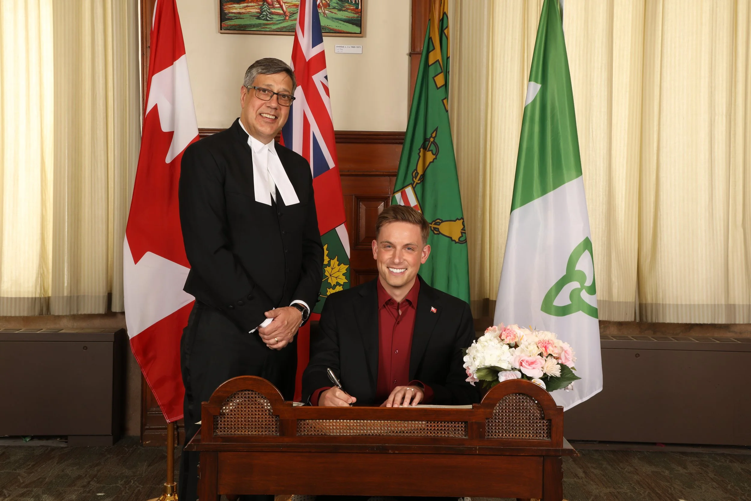 Tyler Watt is being sworn in as Member of Provincial Parliament for Nepean by Trevor Day, the Clerk of the Legislative Assembly of Ontario, at Queen's Park on March 18, 2025.