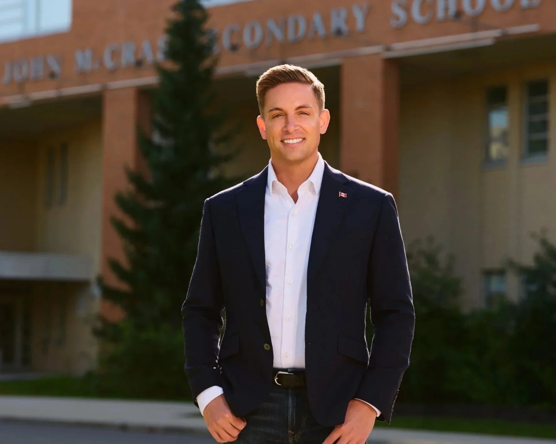Tyler Watt standing outside of John McCrea Secondary School in Barrhaven, where he attended high school.