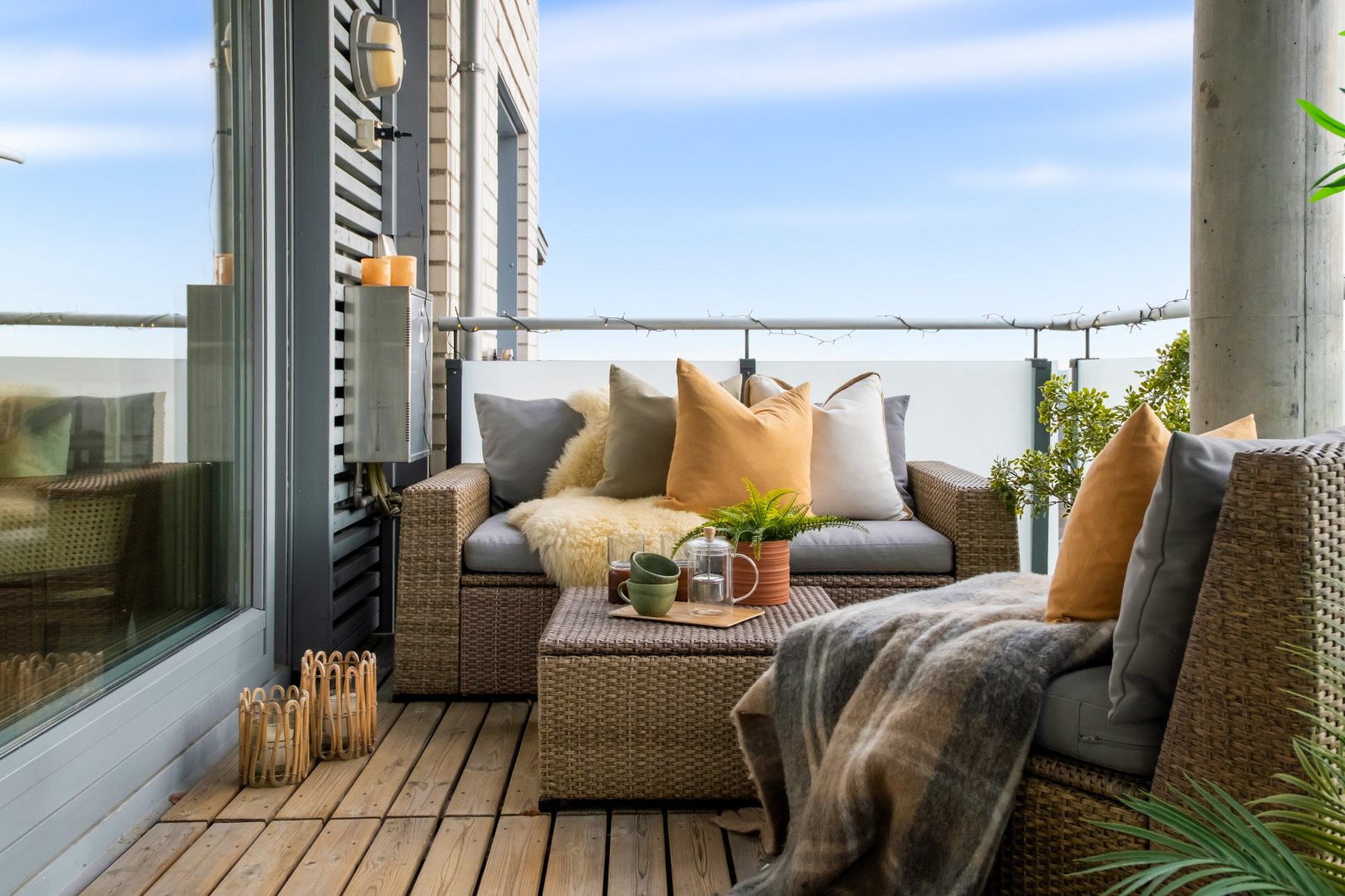 image of a balcony with sofa and pillows