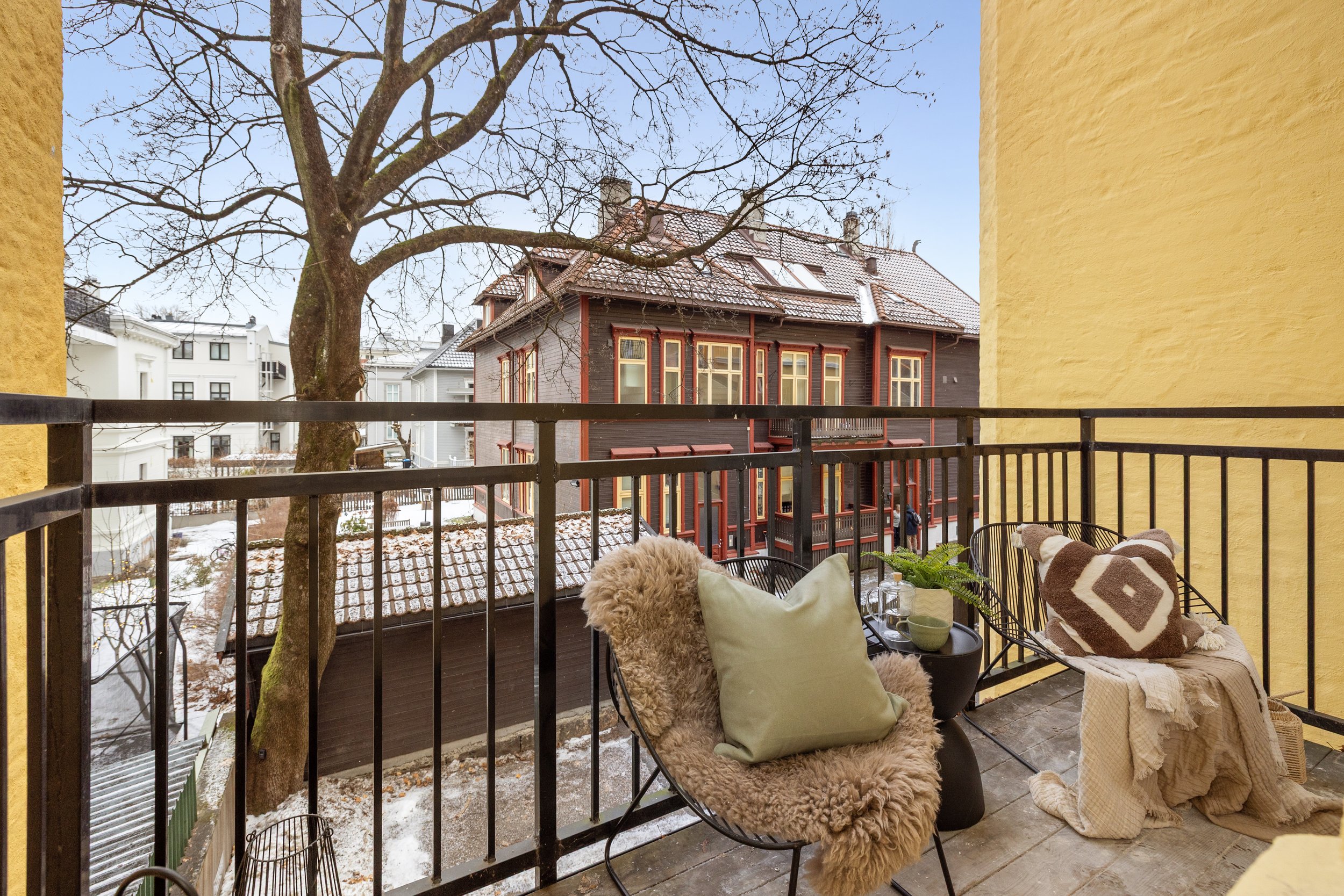 Image of a balcony with to chairs 