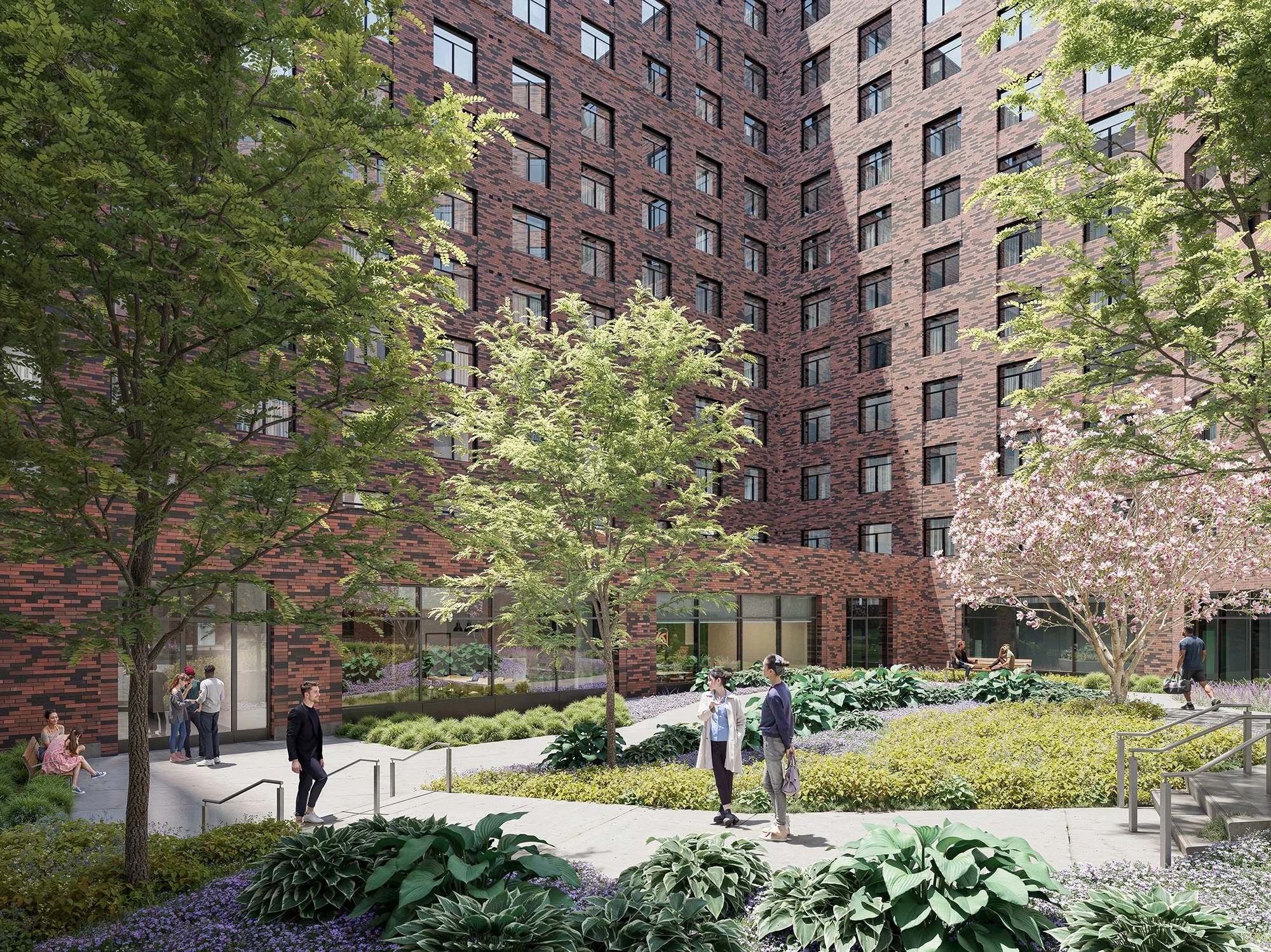 A courtyard surrounded by a multi-story brick apartment building with trees, plants, and people walking and sitting.