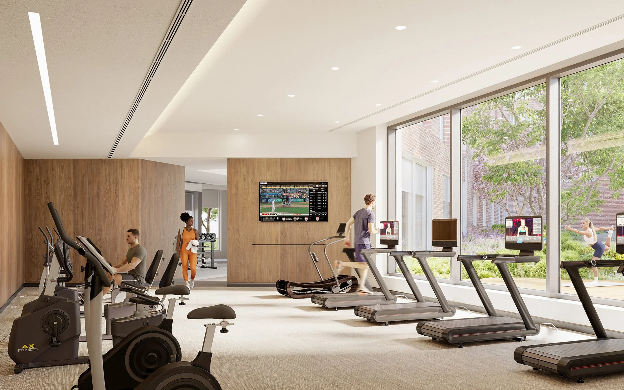 A modern gym with cardio equipment such as treadmills and exercise bikes, large windows showing outdoor greenery, and people working out.
