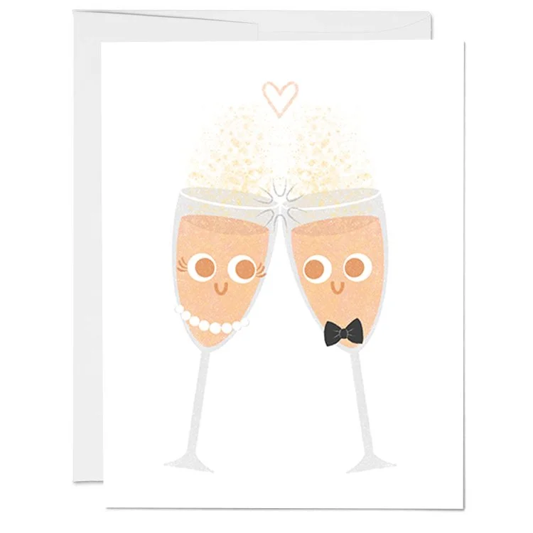 Cartoon illustration of two champagne glasses with smiling faces, one wearing a pearl necklace and the other with a black bow tie, clinking together with a heart above them.