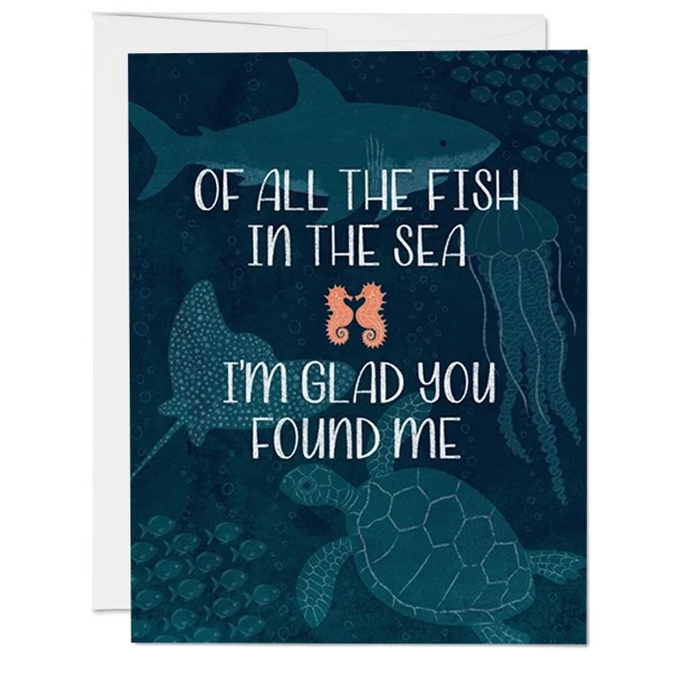 Sea-themed greeting card with illustrations of a shark, jellyfish, turtle, and fish, and the text 'Of all the fish in the sea, I'm glad you found me.'