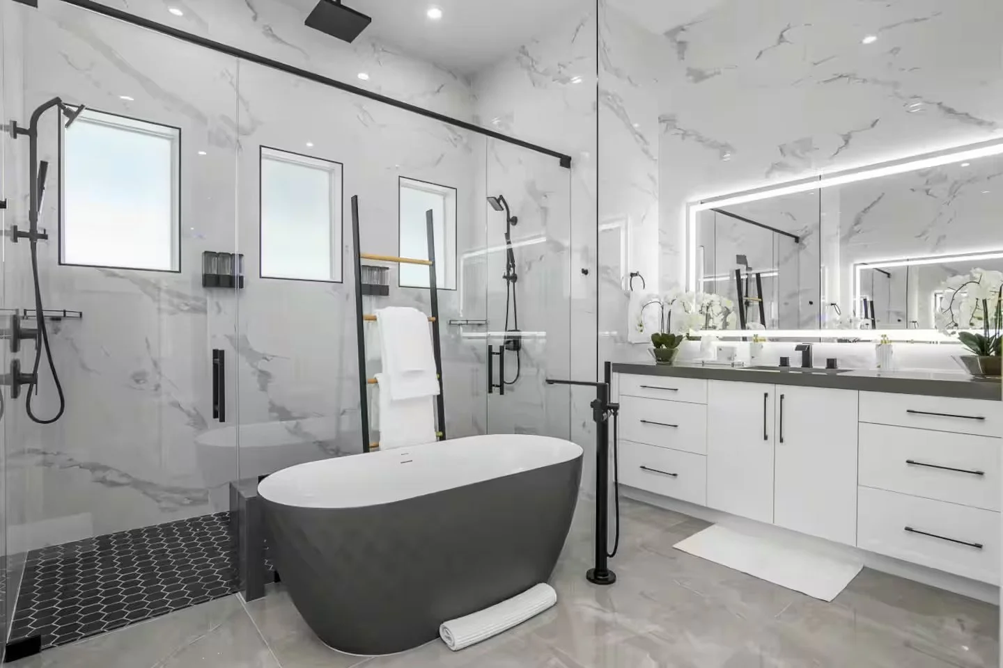 Modern bathroom with white marble walls, a black bathtub, double sink vanity with white cabinets and large mirror, black fixtures, and black accents.