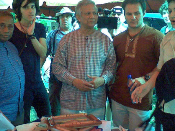 A group of people, including Steve Wanta, at an open market.