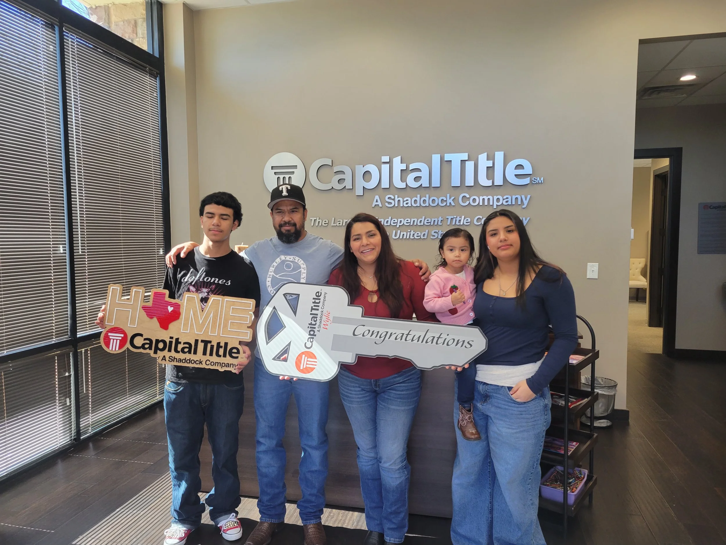 Dulce and family celebrate closing on their home.