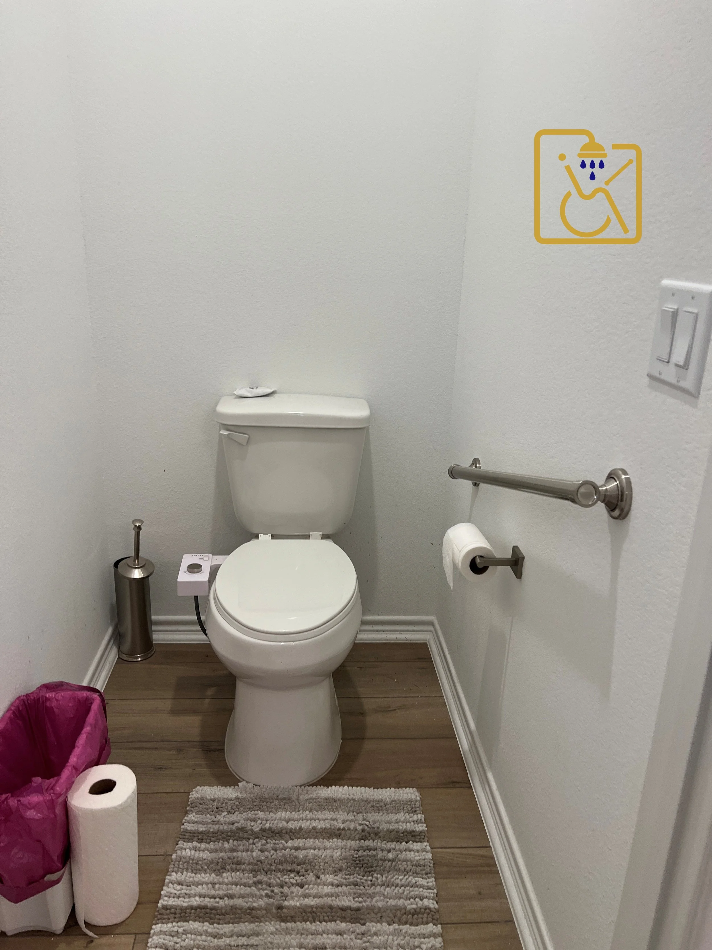 Toilet Grab bar installed in an angle for maximum leverage getting an and sitting down.