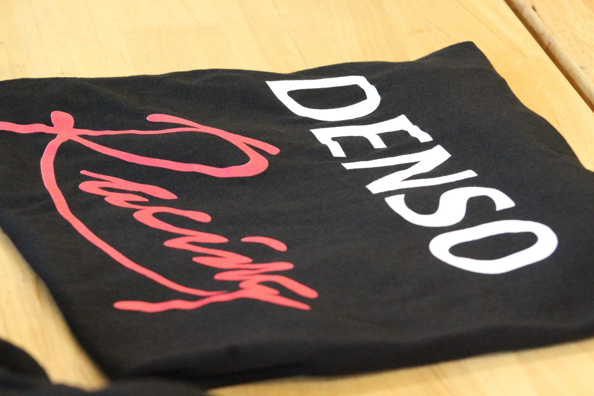 Our Denso Racing shirts are in!