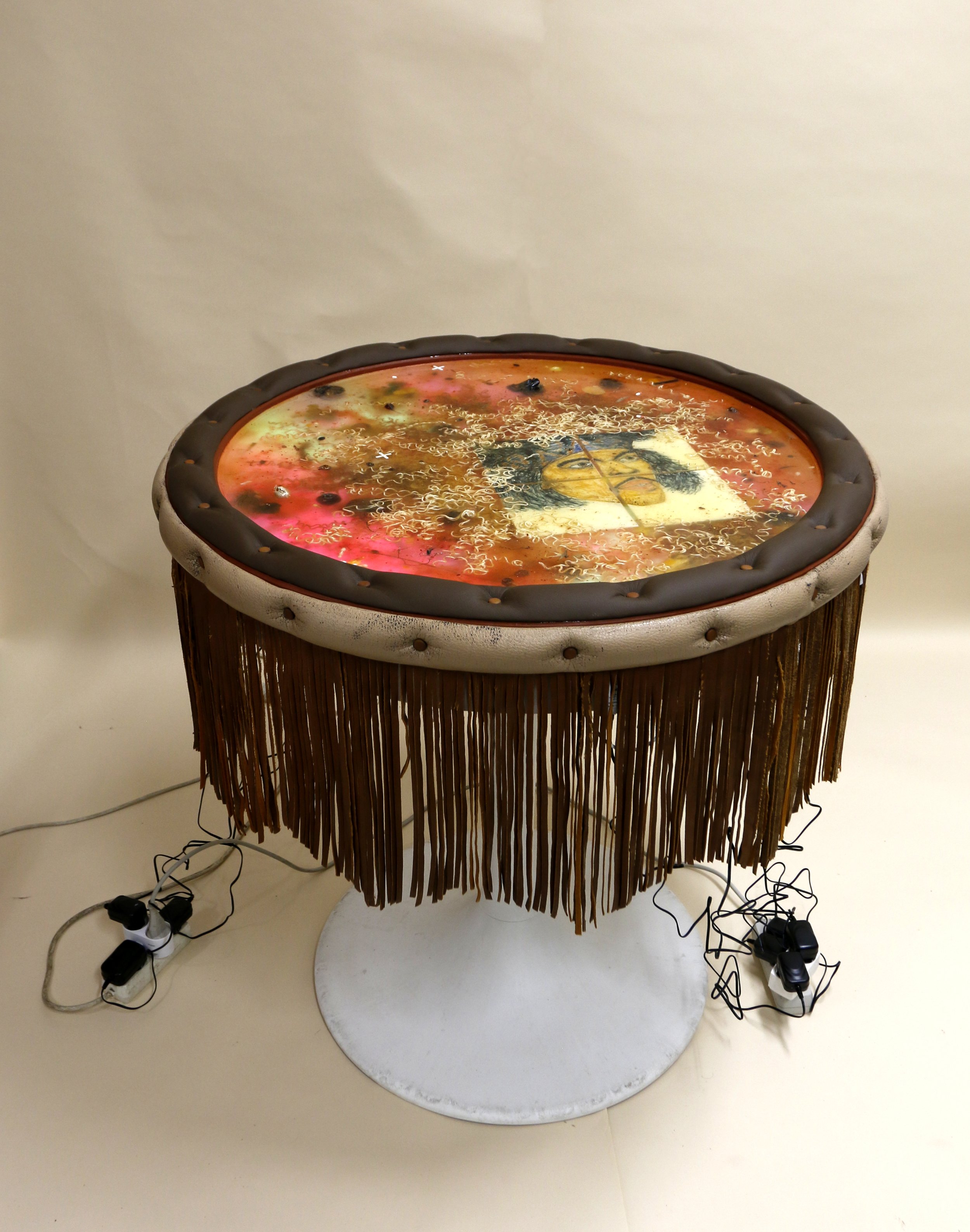 Skeleton (2023)
Sculpture, 100*85*85 cm
Table base, epoxy, cup noodles, underglazed tiles with Jimi Hendrix motif, leather, paint, artificial leather, citrus fruits from the Acropolis, marble from Sicily, found pills from Copenhagen, liberty caps, to