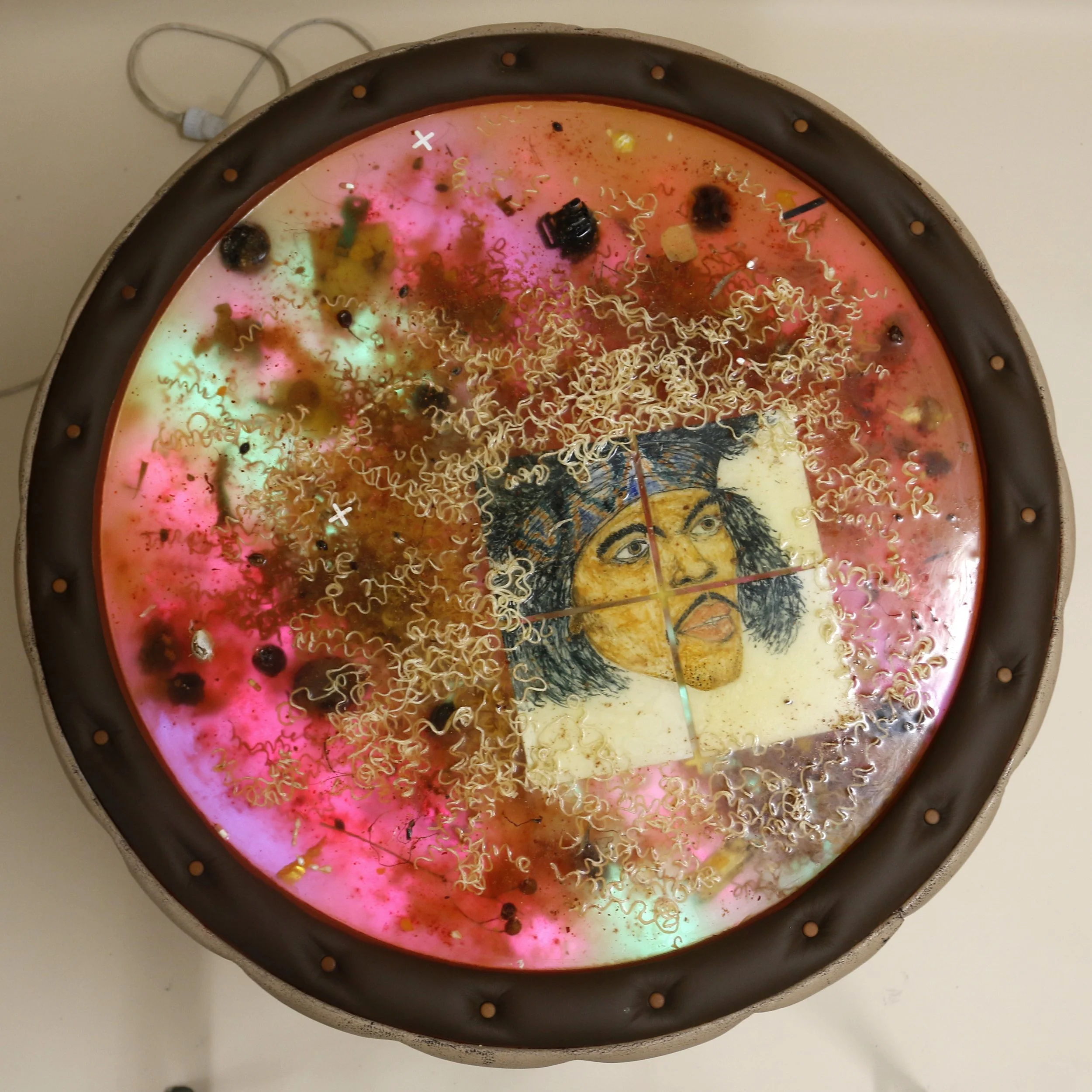 Skeleton (2023)
Sculpture, 100*85*85 cm
Table base, epoxy, cup noodles, underglazed tiles with Jimi Hendrix motif, leather, paint, artificial leather, citrus fruits from the Acropolis, marble from Sicily, found pills from Copenhagen, liberty caps, to