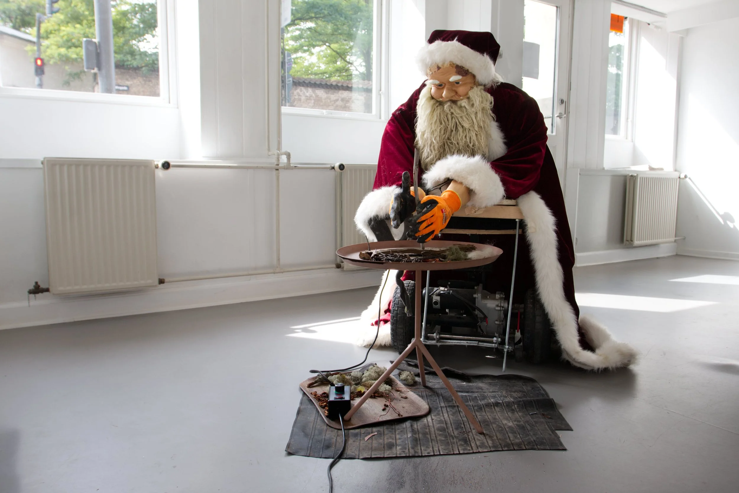 Work Life, robot made from found materials and grinding machine, with hand embroidered mat, 220*150*120 cm, 2025