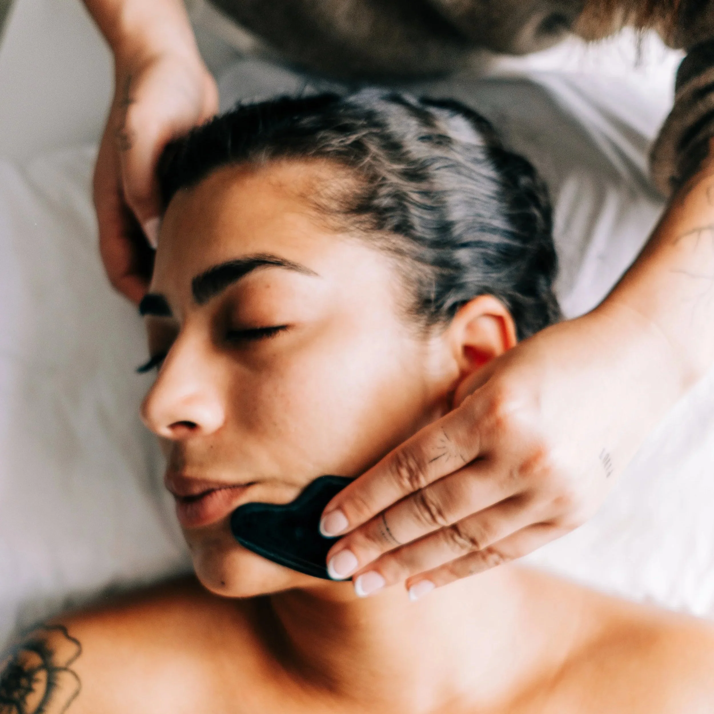 Facial gua sha treatment performed in a Portland Oregon acupuncture studio