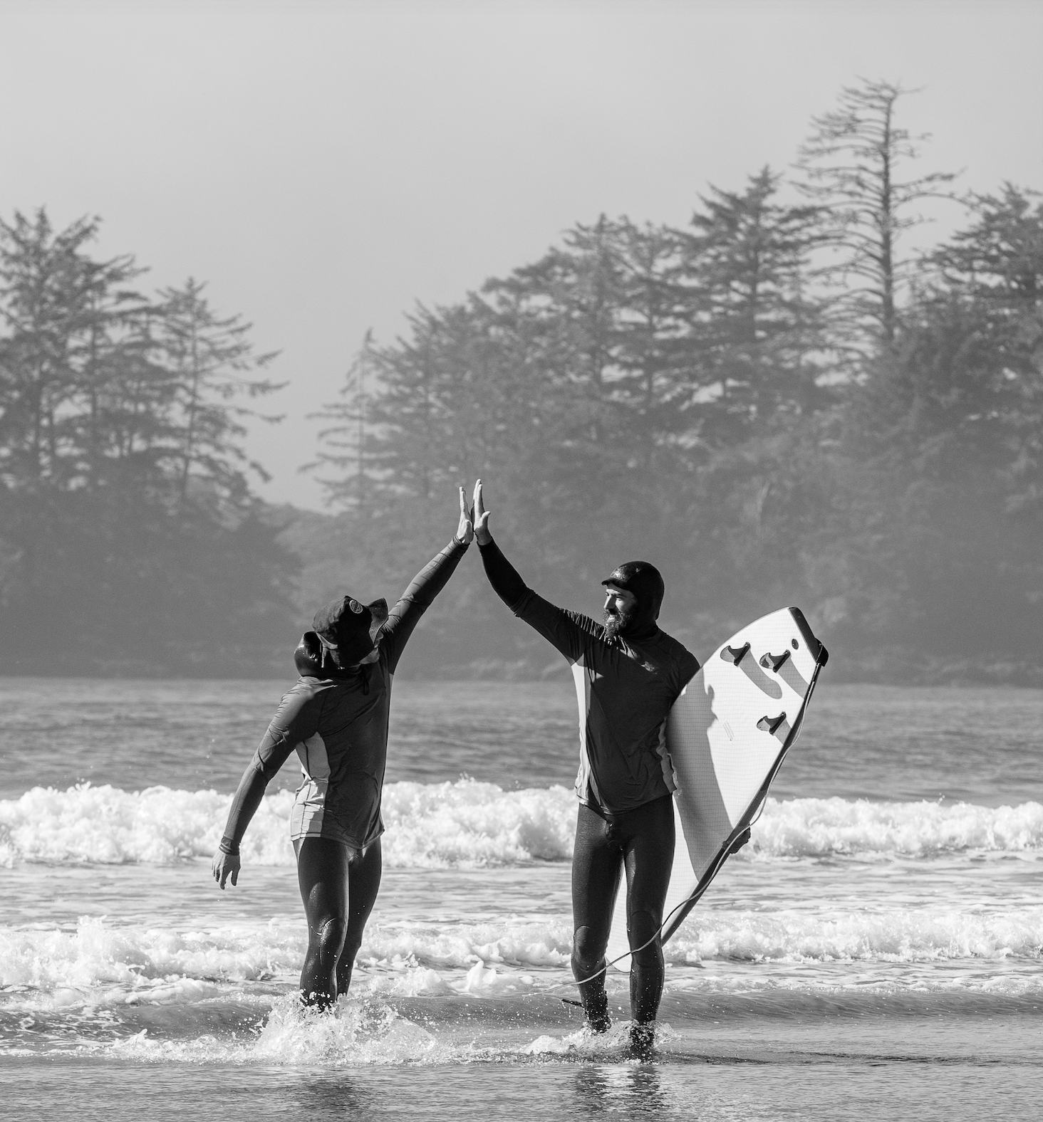 high five ing after a surf lesson on the west coast vancouver island. good times!