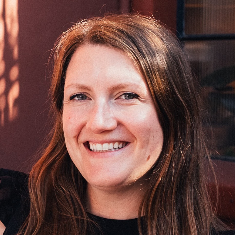 Headshot of Norah Leibow. She has long brown hair and smiles.