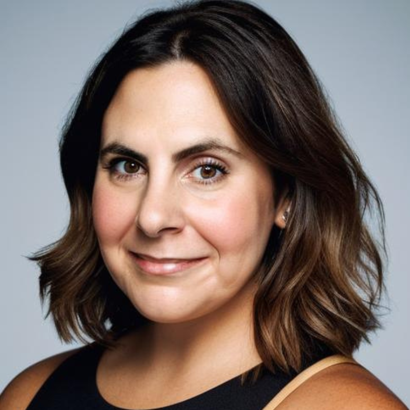 Headshot of Megan Blocker, a white woman with shoulder-length brown hair.