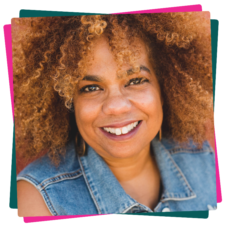 Headshot of Natalie Dunbar. She wears a denim vest and smiles.