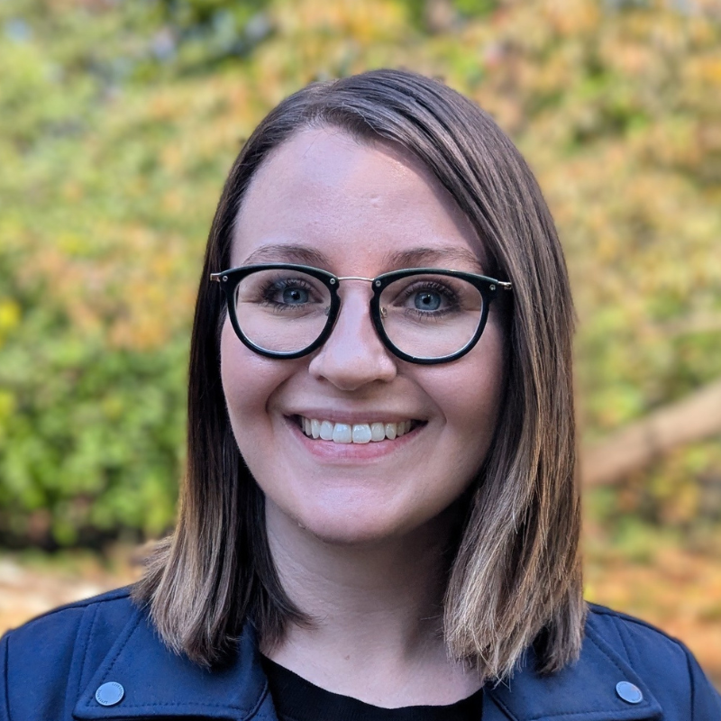 Headshot of Audrey Ross. She wears glasses and smiles.