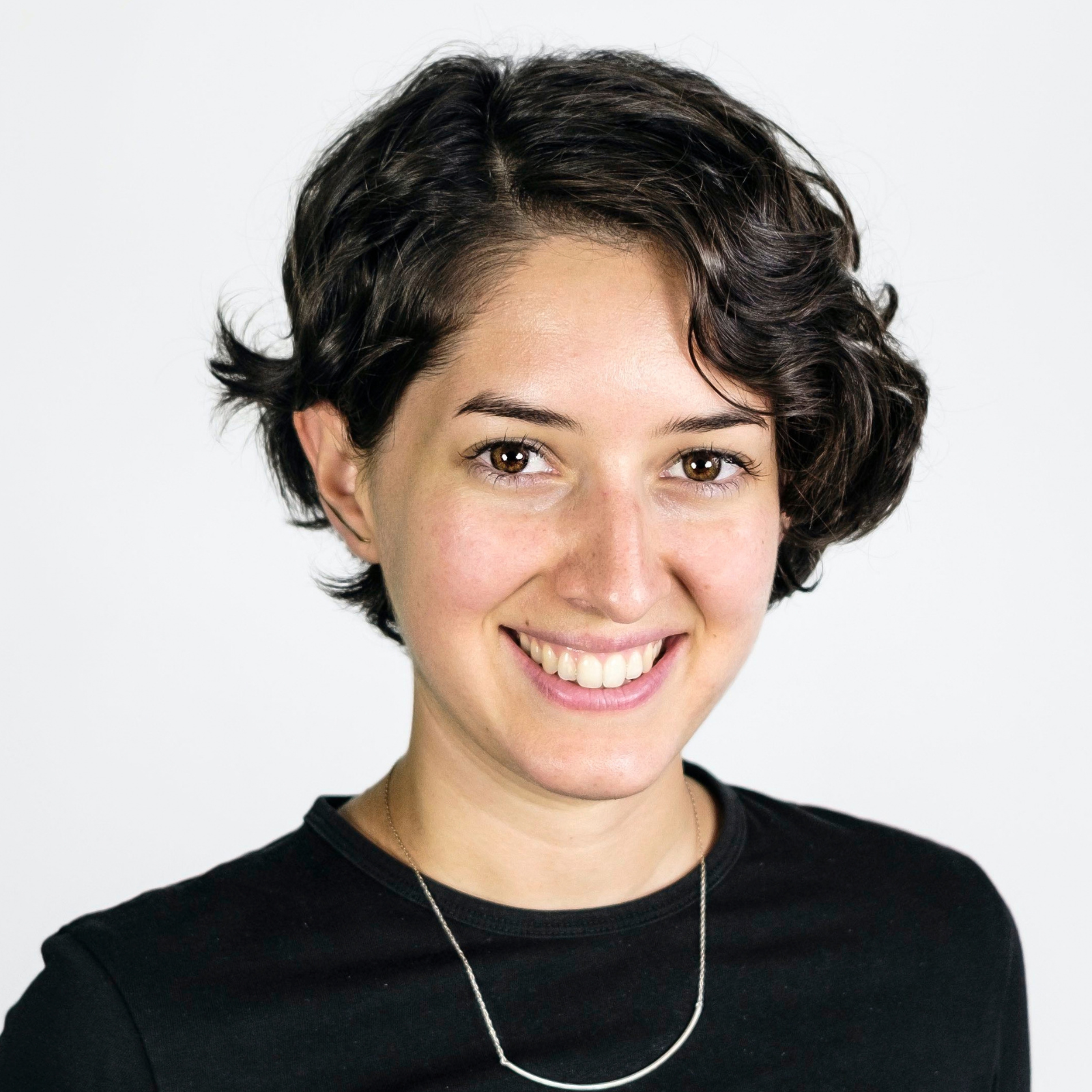 Headshot of Natalia Marmolejo. She has short dark hair and smiles.
