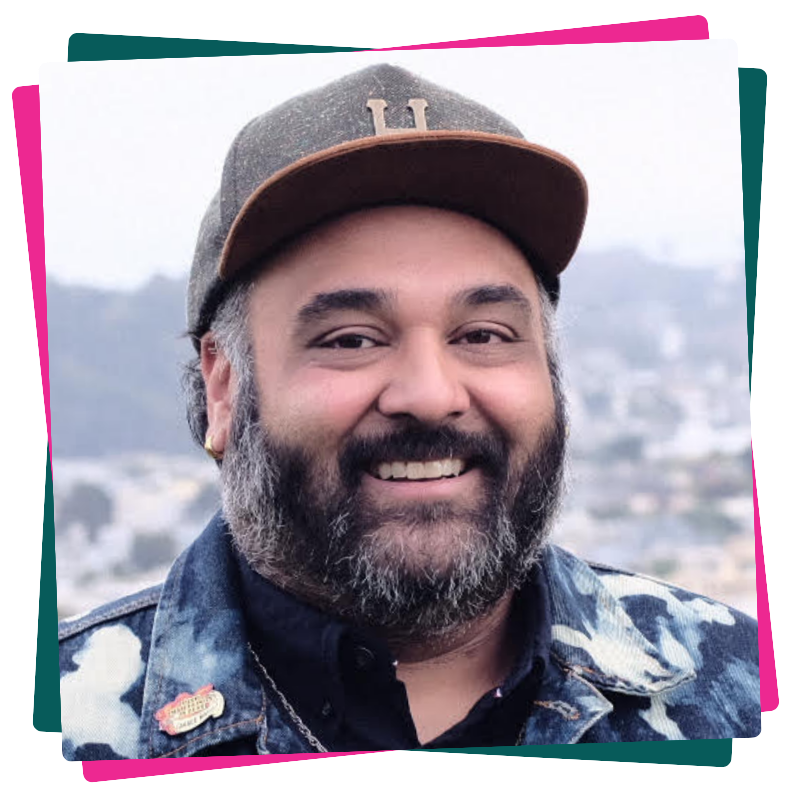 Headshot of Vinay Patel. He wears a ballcap and a denim jacket.