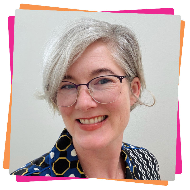 Headshot of Caitlin Steele. She has grey hair and wears glasses.