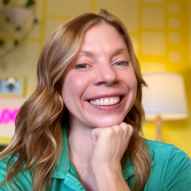 Headshot of Sophia Prater, a white woman with reddish-blond hair wearing a green top.