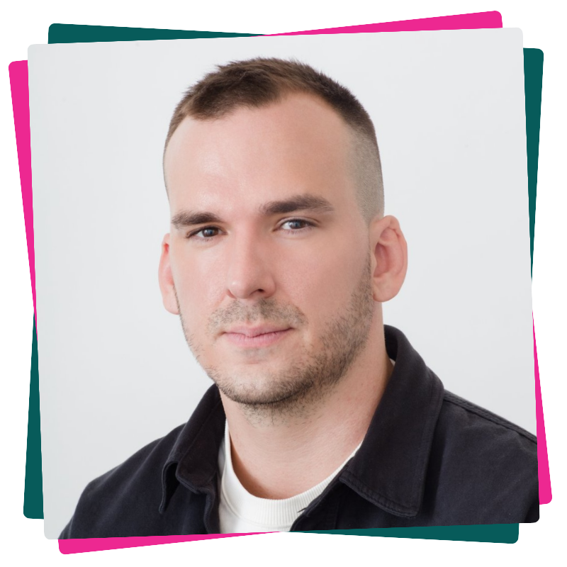 Headshot of Kyle Alexander. He wears a black jacket. 
