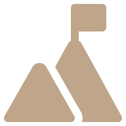 Tan icon of a mountain with a flag on top.
