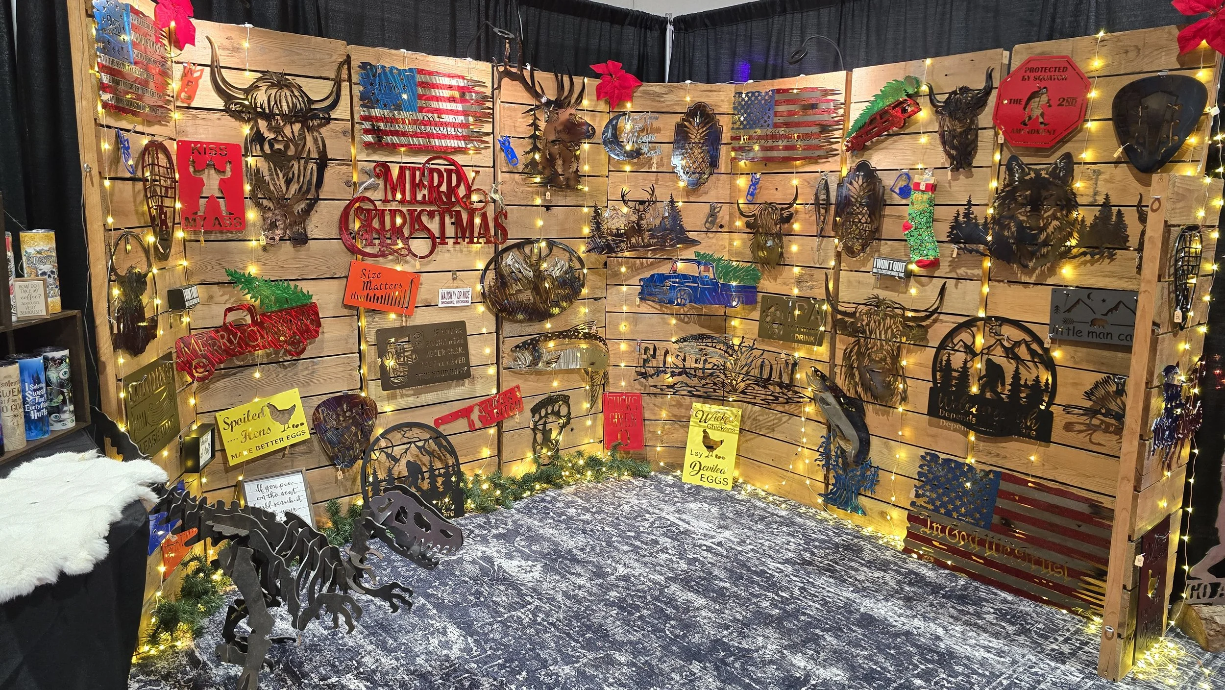 Iron Ridge Inc.'s custom metal art vendor display at the Portland Holiday Market. Shop Christmas gifts and home decor.